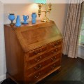 F31. Antique burlwood slant front desk. 